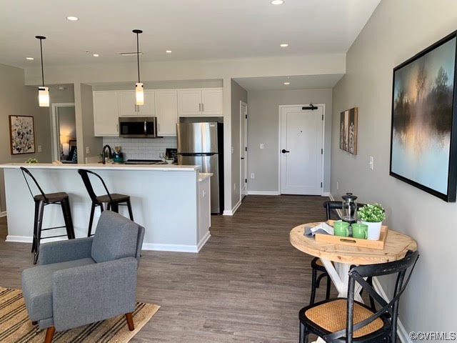 1504 Ewing Park Loop, Unit 203 Midlothian, VA 23113 - Photo 10 of 17 a view of a dining room with furniture