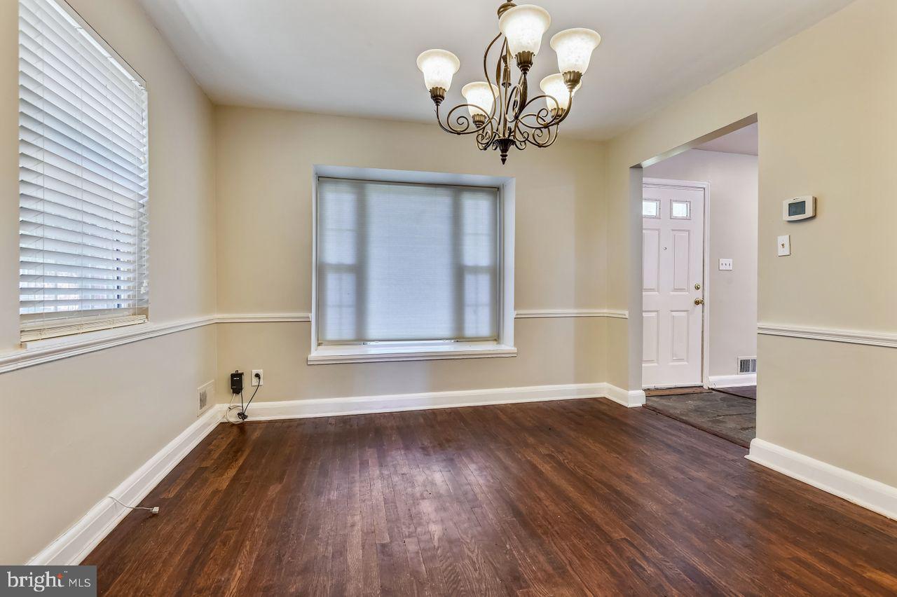 7035 Concord Road Pikesville, MD 21208 - Photo 13 of 35 Dining Room with Sunny Window & Chair Rail