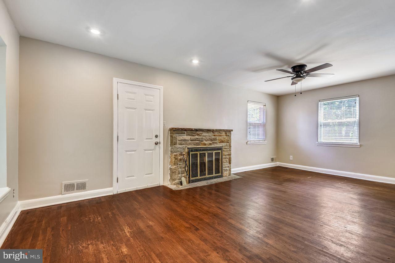 7035 Concord Road Pikesville, MD 21208 - Photo 19 of 35 Really Large Living Room with Stone Fireplace