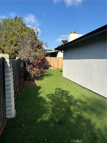 a backyard of a house with lots of green space