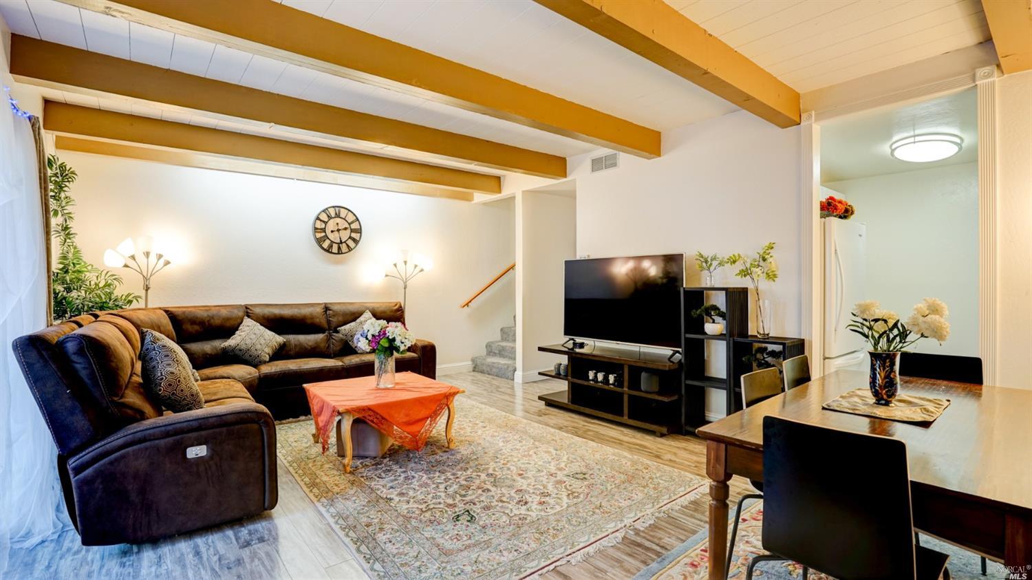 1548 Center Road, Unit 29 Novato, CA 94947 - Photo 1 of 1 a living room with furniture and a flat screen tv