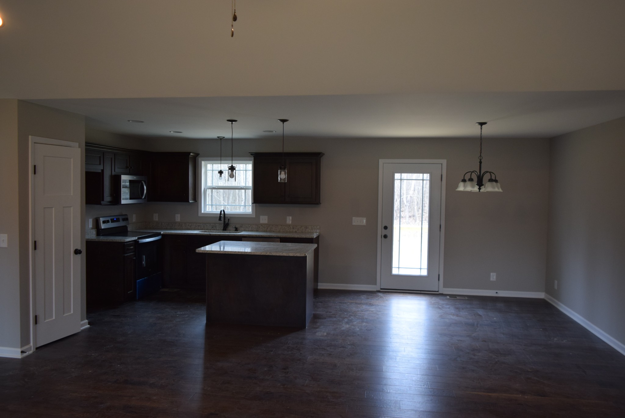 213 Ballard Road Manchester, TN 37355 - Photo 2 of 10 a kitchen with a refrigerator and a stove top oven