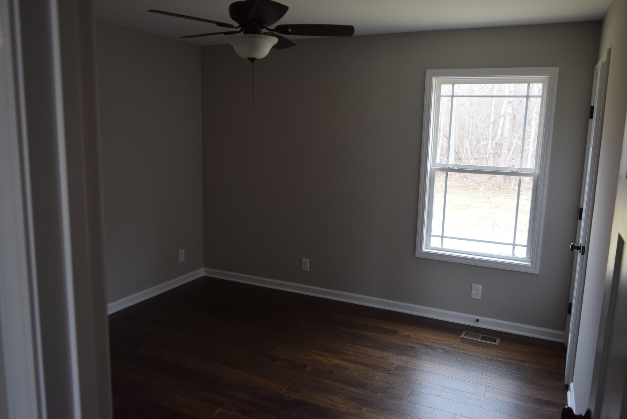 213 Ballard Road Manchester, TN 37355 - Photo 5 of 10 wooden floor and window in an empty room