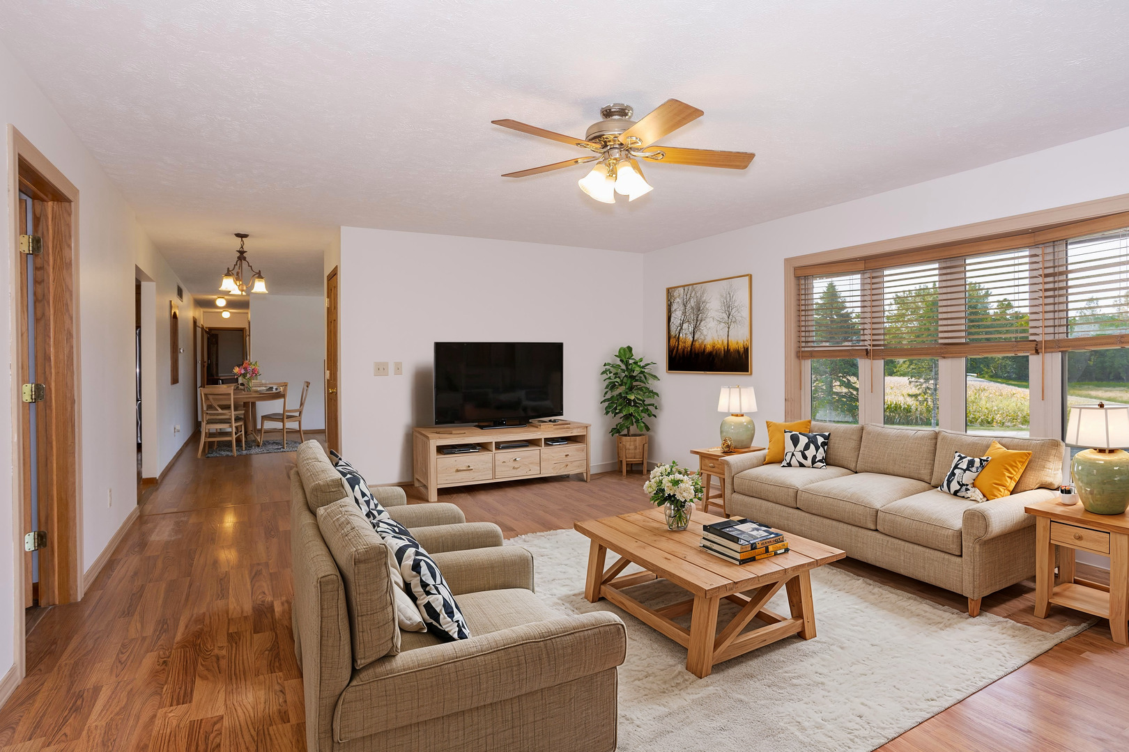14610 Halsey Road Heyworth, IL 61745 - Photo 15 of 51 a living room with furniture flat screen tv and a large window