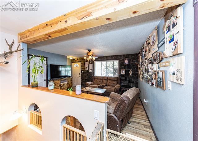 6727 Seneca Road Colorado Springs, CO 80915 - Photo 9 of 50 This home has custom wood features throughout! Look at the beautiful wood beam!