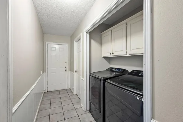 a kitchen with a stove and a refrigerator