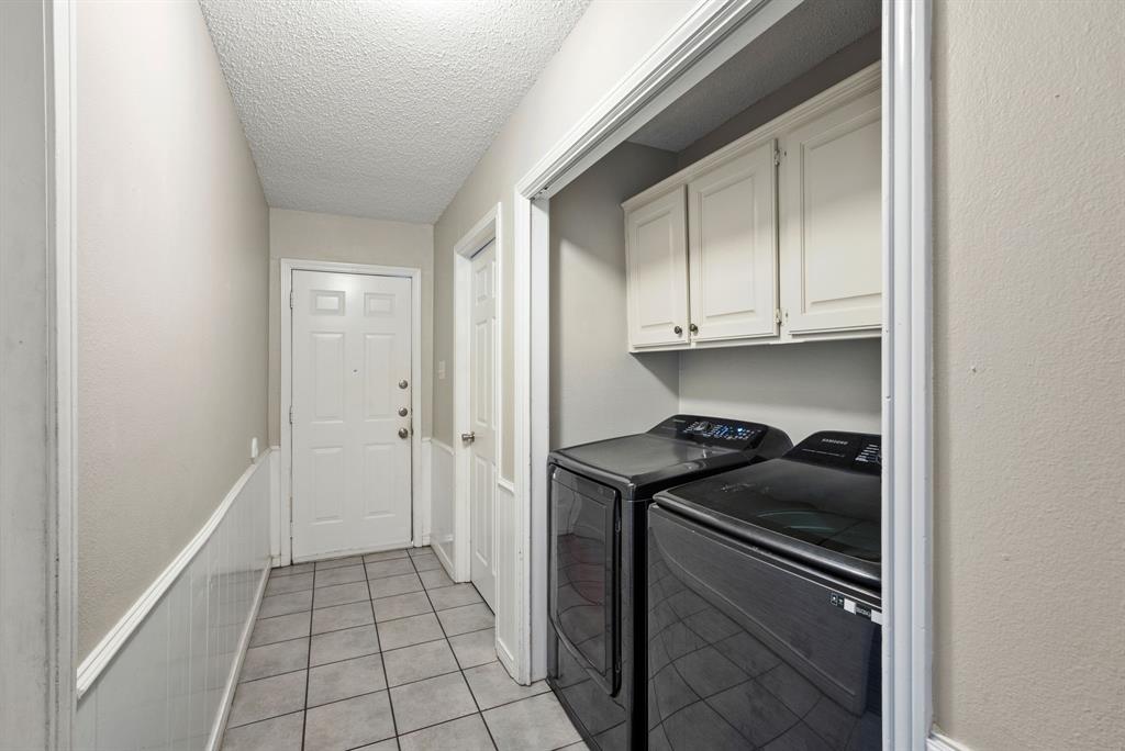 2103 Easy Street Tyler, TX 75703 - Photo 18 of 32 a kitchen with a stove and a refrigerator