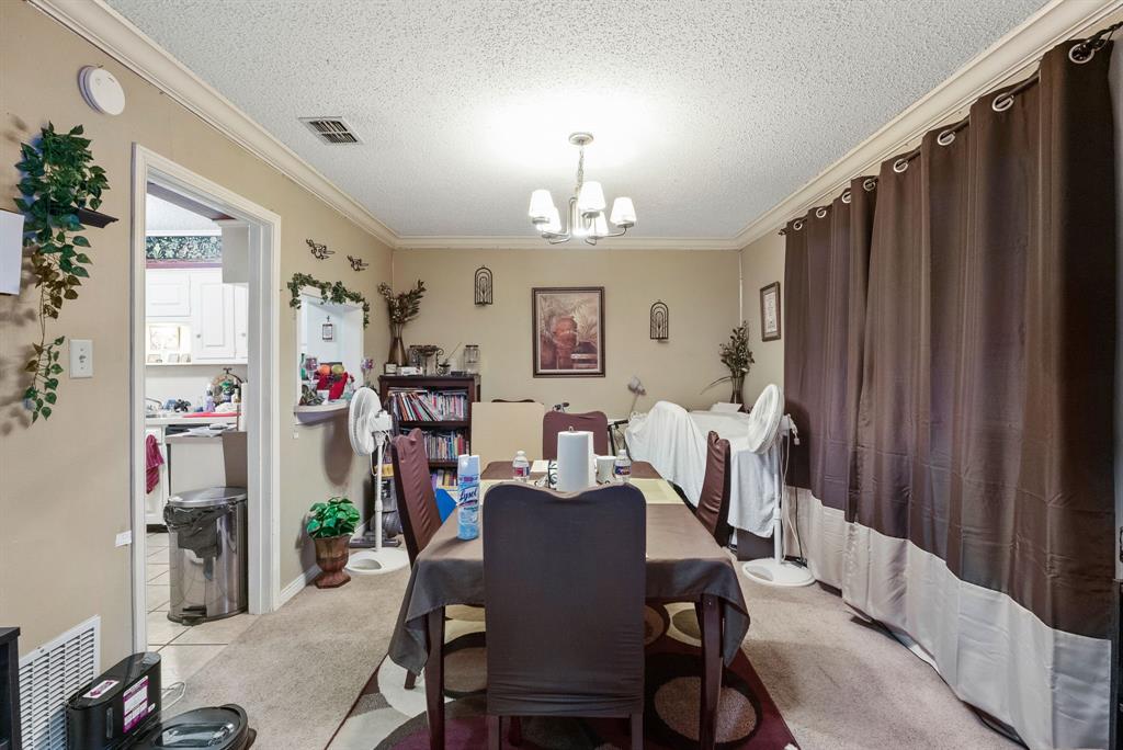 2103 Easy Street Tyler, TX 75703 - Photo 23 of 32 a view of a dining room with furniture window and wooden floor