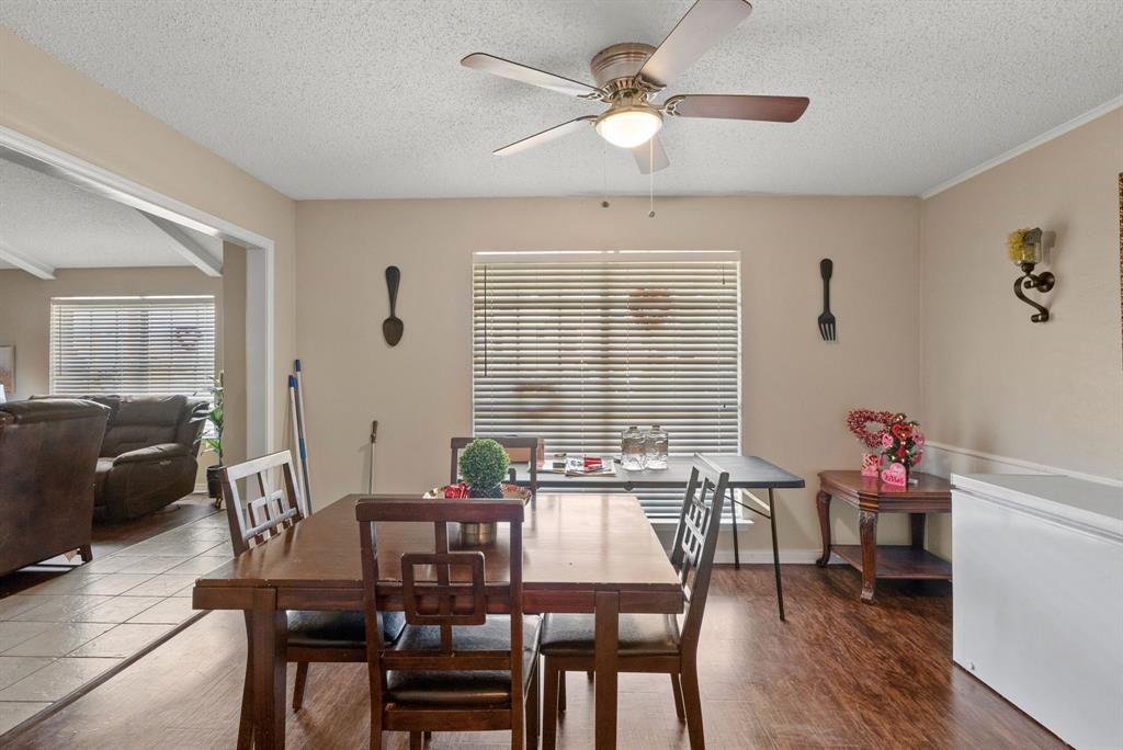 2103 Easy Street Tyler, TX 75703 - Photo 7 of 32 a view of a dining room with furniture window and wooden floor