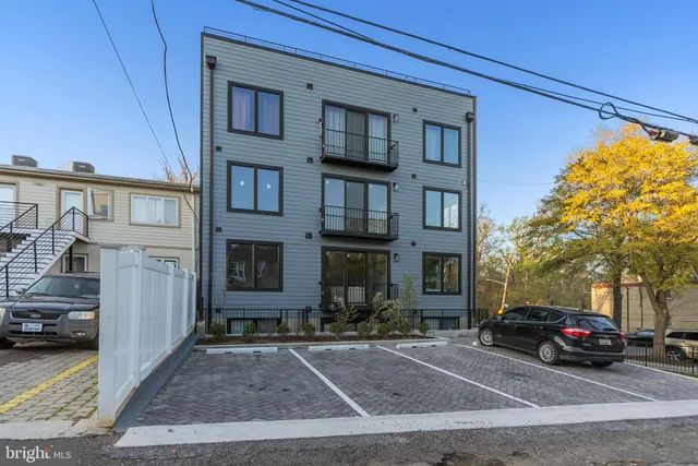 a view of a car park in front of a building