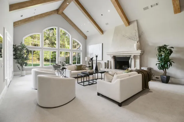 an aerial view of residential house with yard and outdoor seating