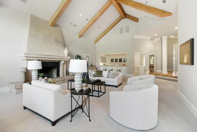a bathroom with a granite countertop sink toilet a mirror and shower