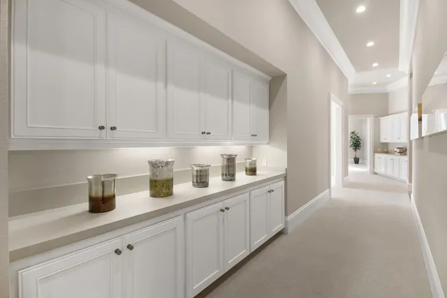 a kitchen with granite countertop stainless steel appliances a stove sink and cabinets