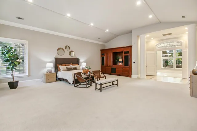 a dining room with furniture and a window