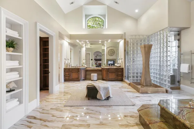 a view of a room that has a window and chair