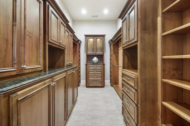 a view of a garden with a building in the background