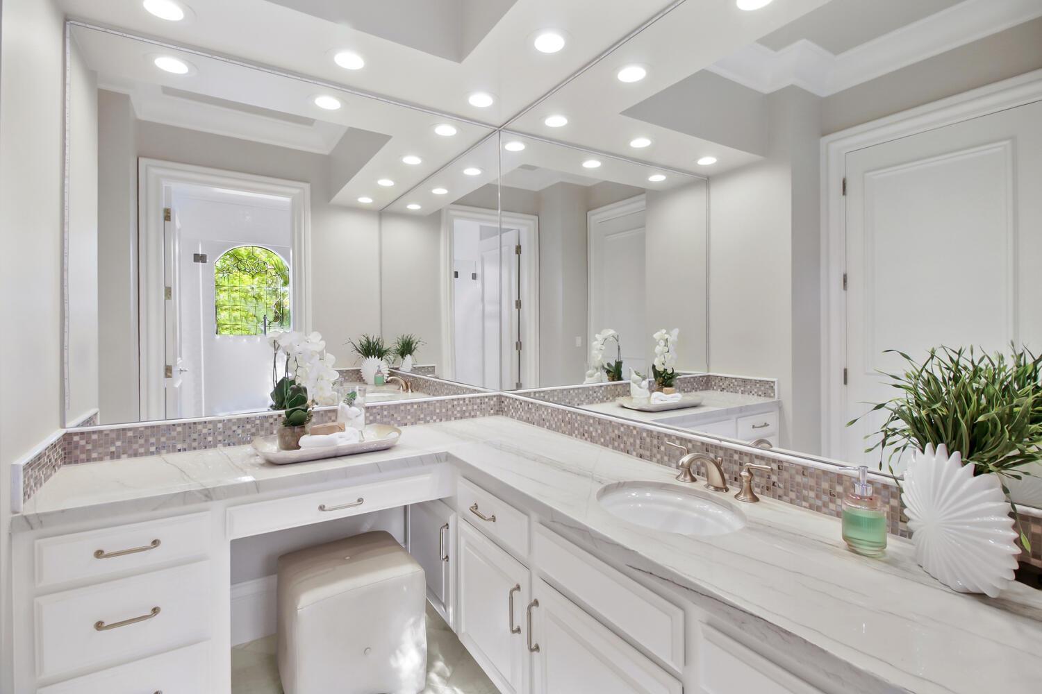 5001 Auburn Folsom Road Loomis, CA 95650 - Photo 49 of 99 a spacious bathroom with a granite countertop sink a mirror and a bathtub with shower