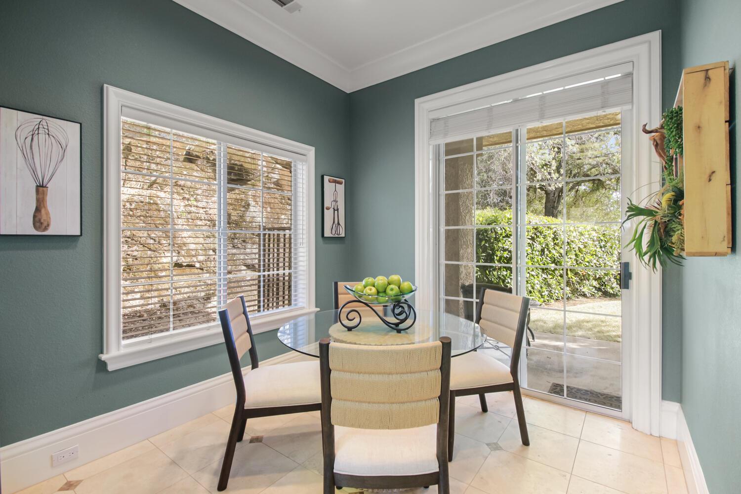 5001 Auburn Folsom Road Loomis, CA 95650 - Photo 68 of 99 a dining room with furniture and a window