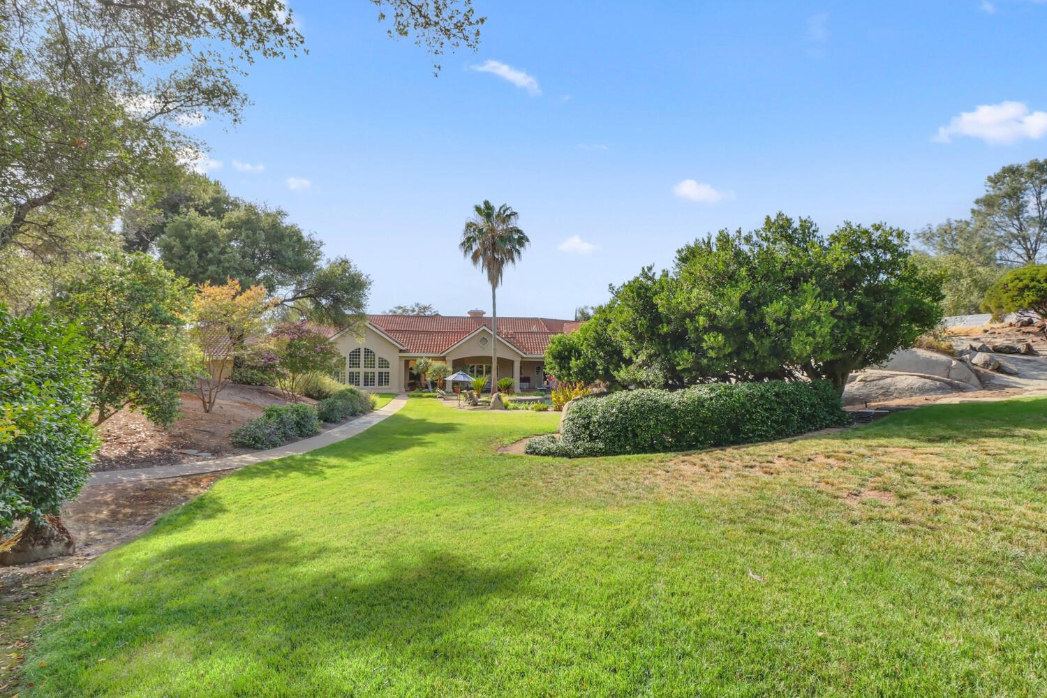 5001 Auburn Folsom Road Loomis, CA 95650 - Photo 87 of 99 a view of a garden with a building in the background