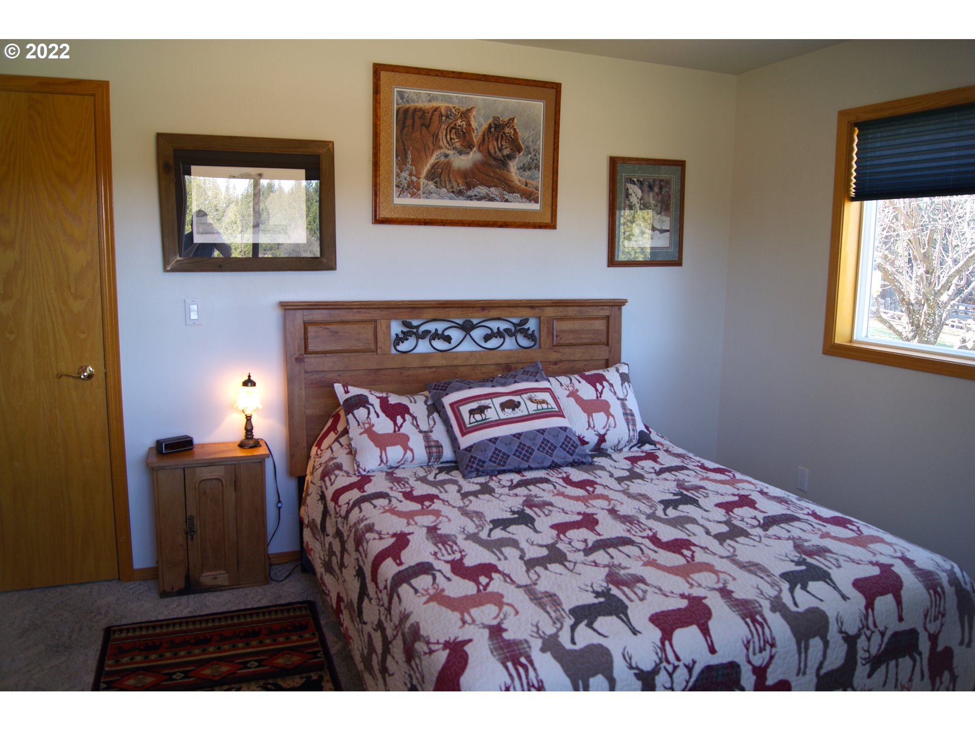 69398 County 1021 Road Pendleton, OR 97801 - Photo 8 of 28 a bedroom with a bed and a painting on the wall