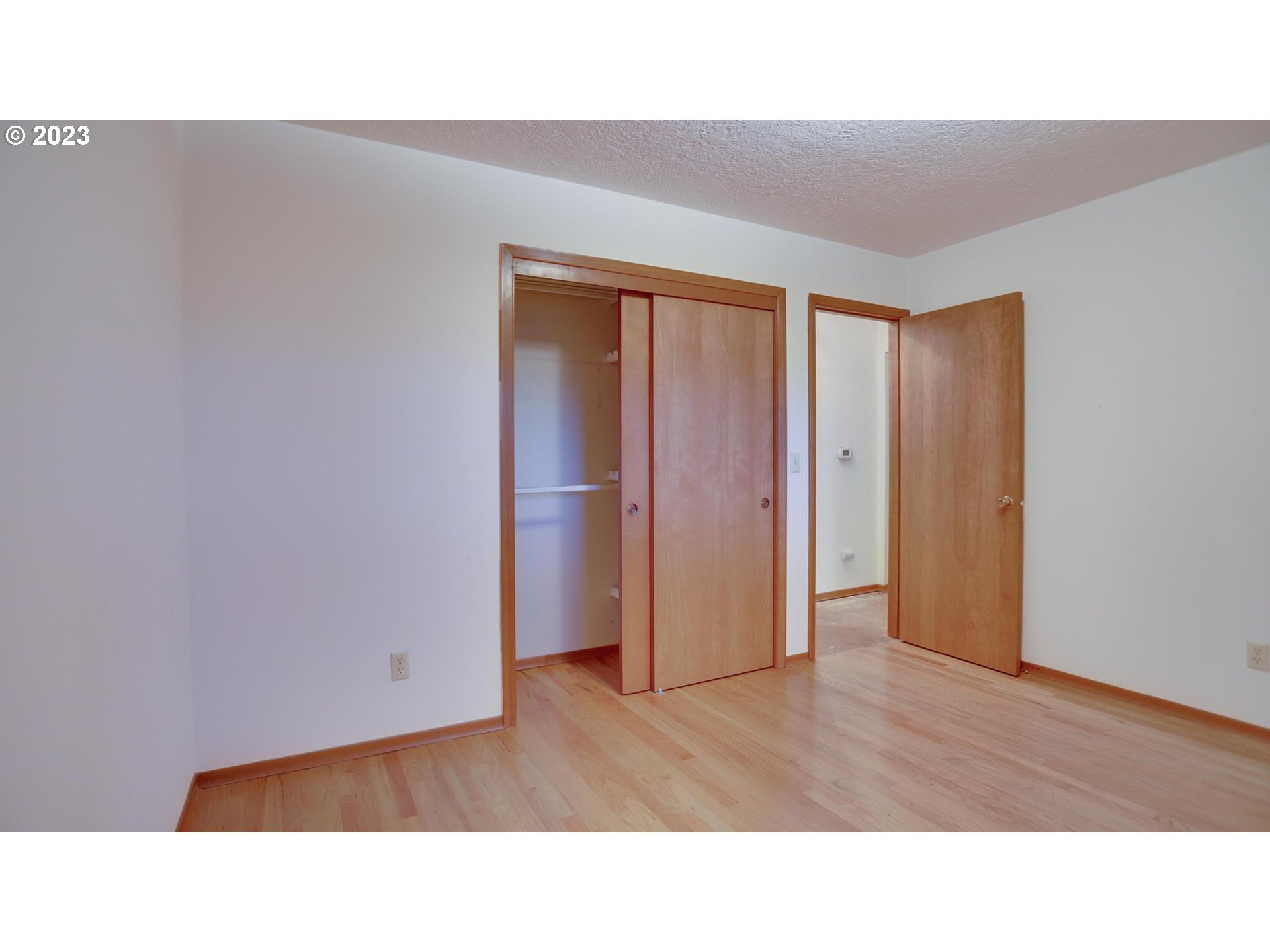 21985 Southeast Borges Road Damascus, OR 97089 - Photo 17 of 24 a open living room with a wooden floor