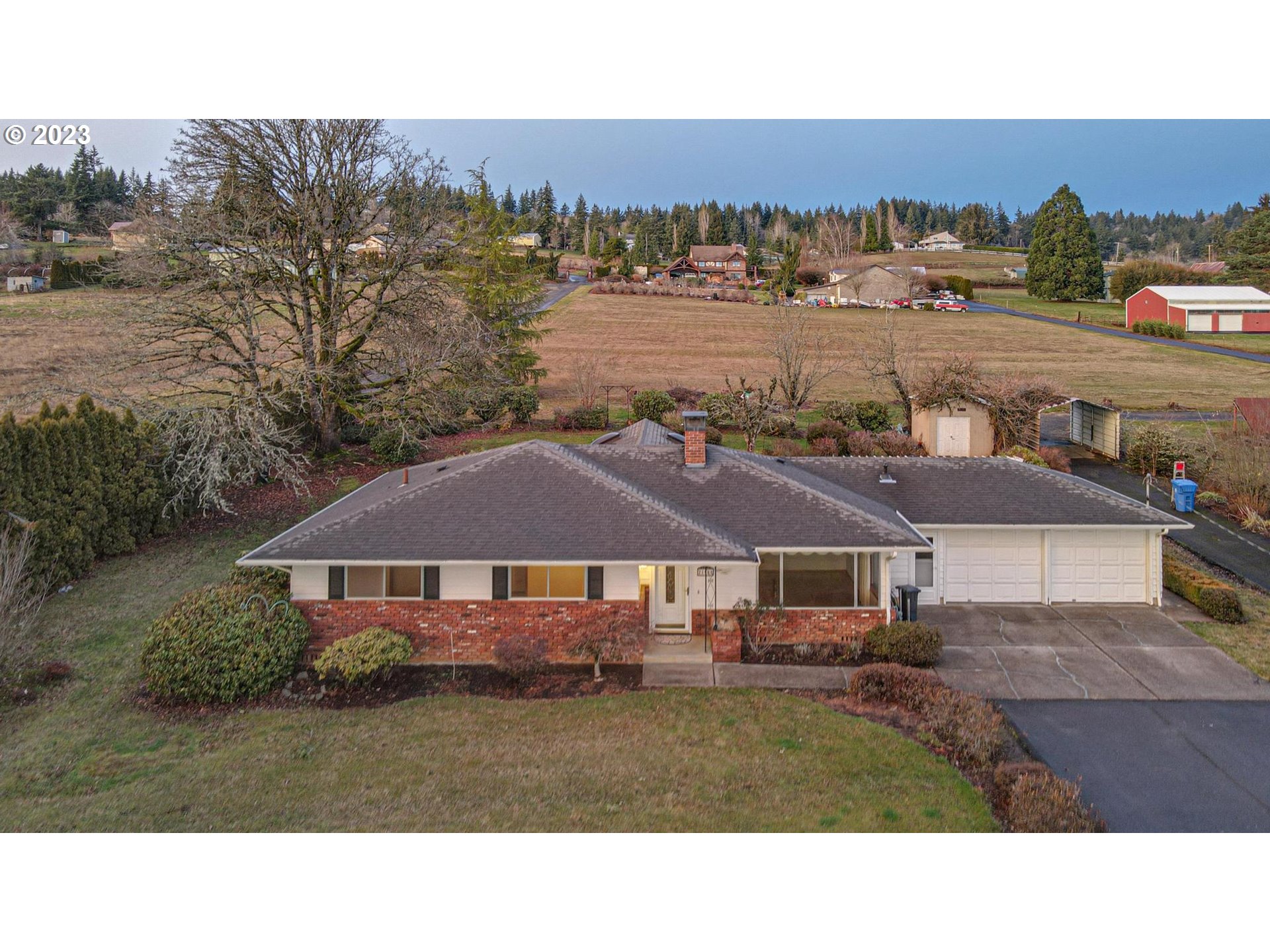 21985 Southeast Borges Road Damascus, OR 97089 - Photo 22 of 24 a view of house with outdoor space and lake view