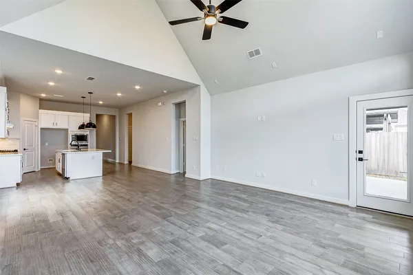 a view of kitchen with cabinet and wooden floor