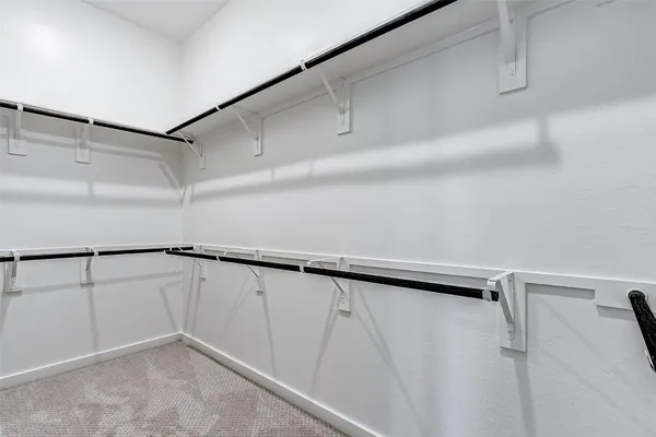 a view of a room with racks on the wall