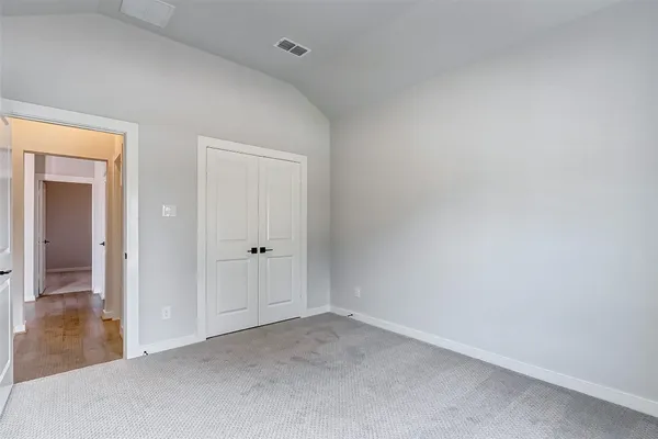 a view of an empty room and closet
