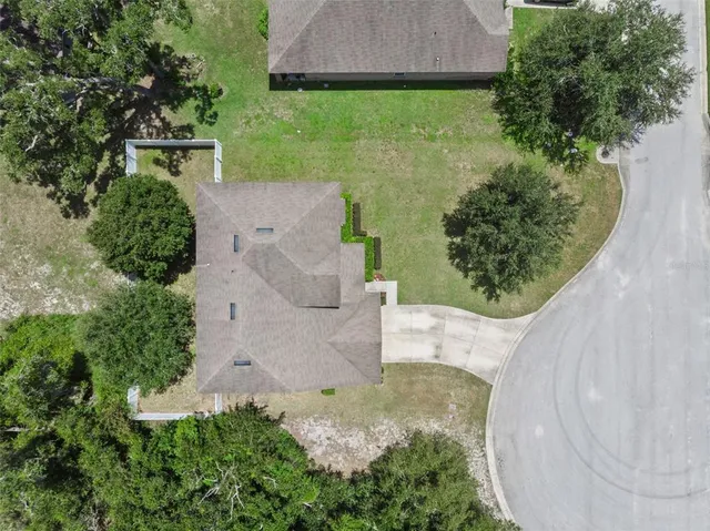 a sign that is sitting on a green field