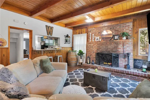 a living room with furniture and a rug