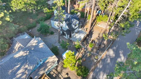 a front view of a house with trees