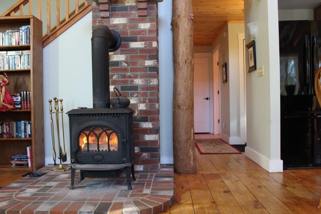 12 Hodgdon Road Shapleigh, ME 04076 - Photo 17 of 32 Wood stove on brick hearth in center...