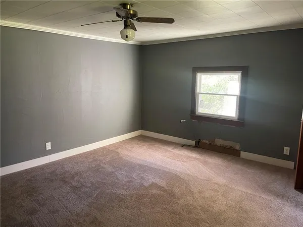 a view of an empty room with a window