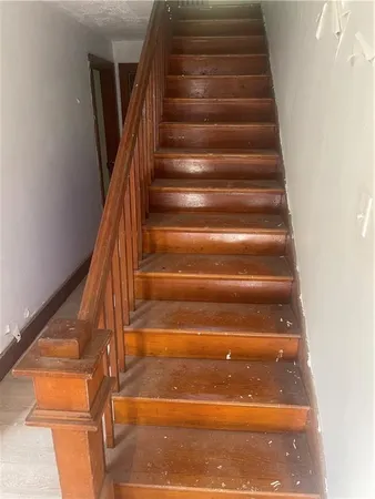a view of room with lounge chair and windows