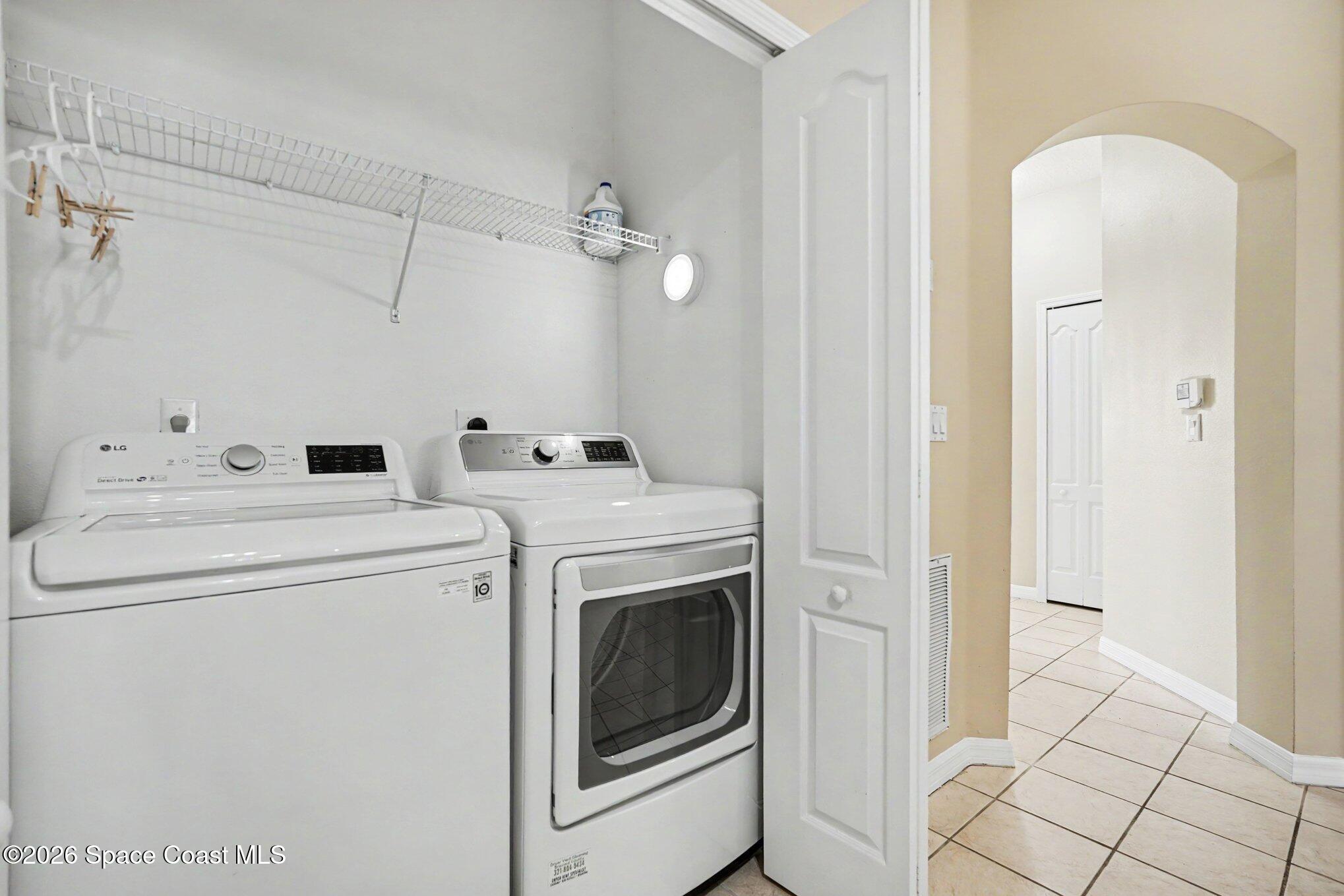 284 Intrepid Way Indialantic, FL 32903 - Photo 18 of 36 a utility room with dryer and washer