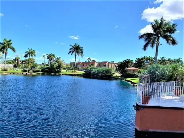 a view of a lake with a house in the background