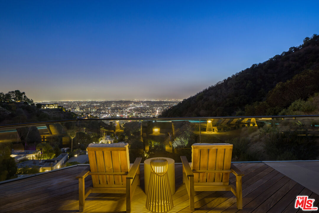 1877 Rising Glen Road Los Angeles, CA 90069 - Photo 29 of 29 a view of a chairs and table in patio