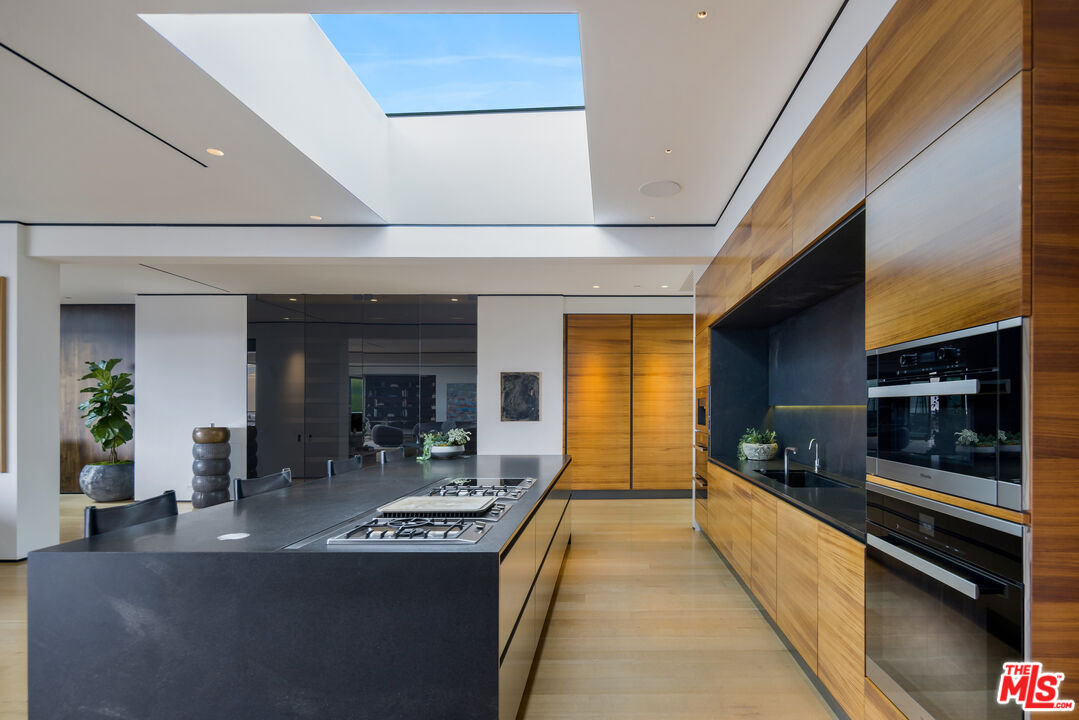 1877 Rising Glen Road Los Angeles, CA 90069 - Photo 6 of 29 a lobby with furniture and flat screen tv