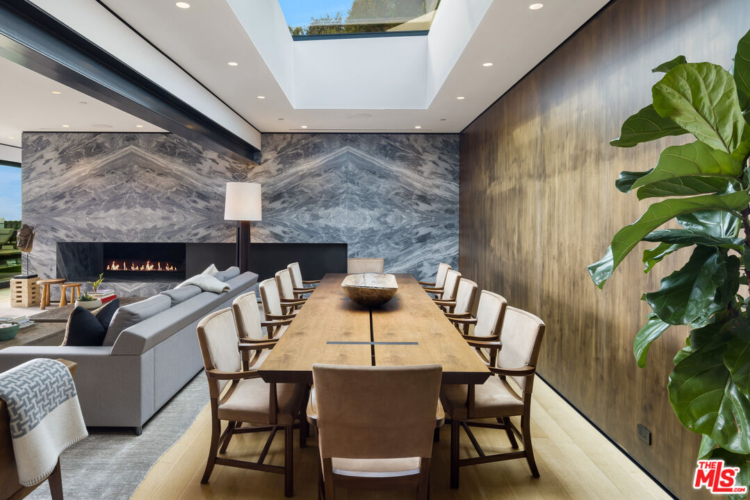 1877 Rising Glen Road Los Angeles, CA 90069 - Photo 7 of 29 a view of a dining room with furniture and wooden floor