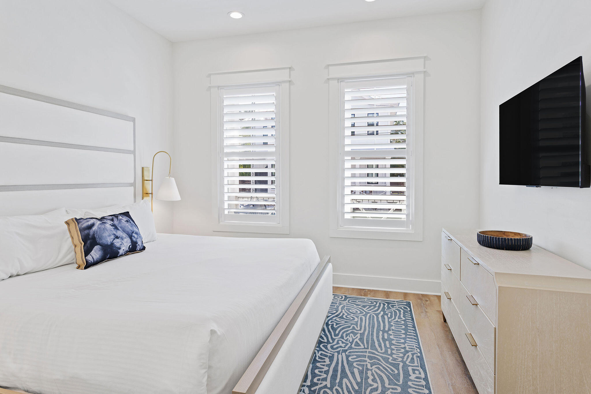 158 Brown Street Santa Rosa Beach, FL 32459 - Photo 15 of 46 a bedroom with a bed and a flat screen tv