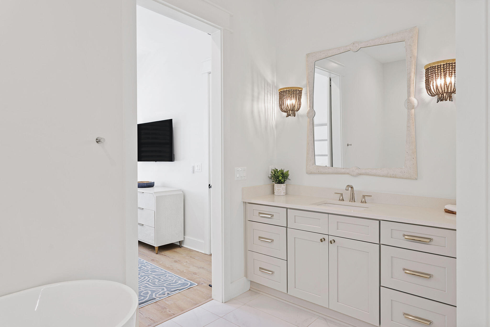 158 Brown Street Santa Rosa Beach, FL 32459 - Photo 16 of 46 a spacious bathroom with a toilet sink and mirror