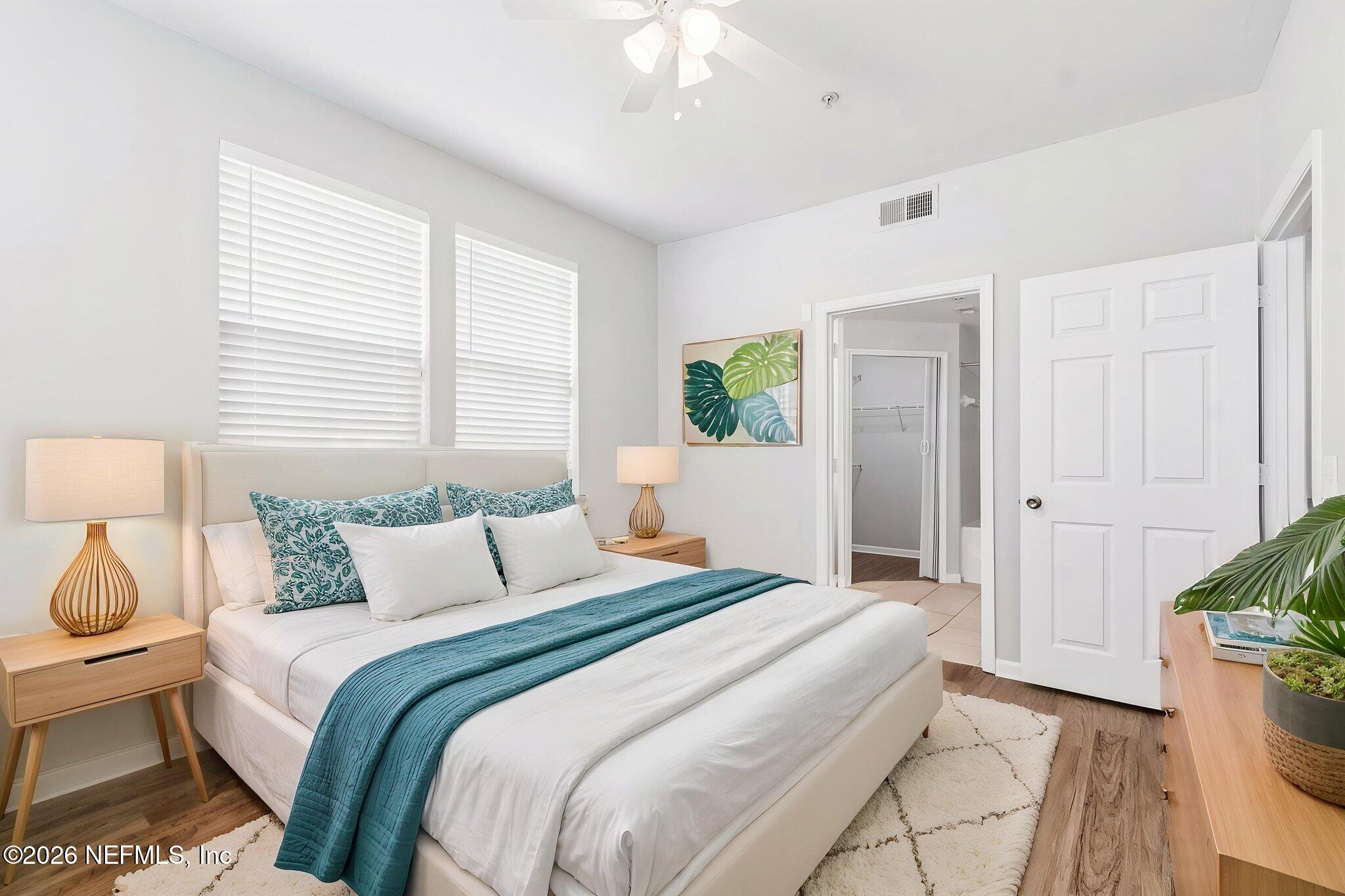 8550 Touchton Road, Unit 511 Jacksonville, FL 32216 - Photo 27 of 63 a bedroom with a bed and a potted plant