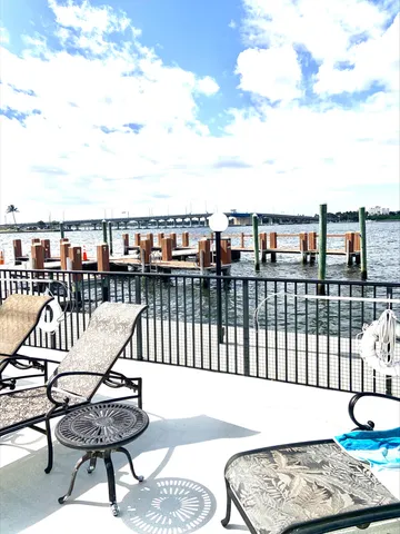 a view of a balcony with wooden floor