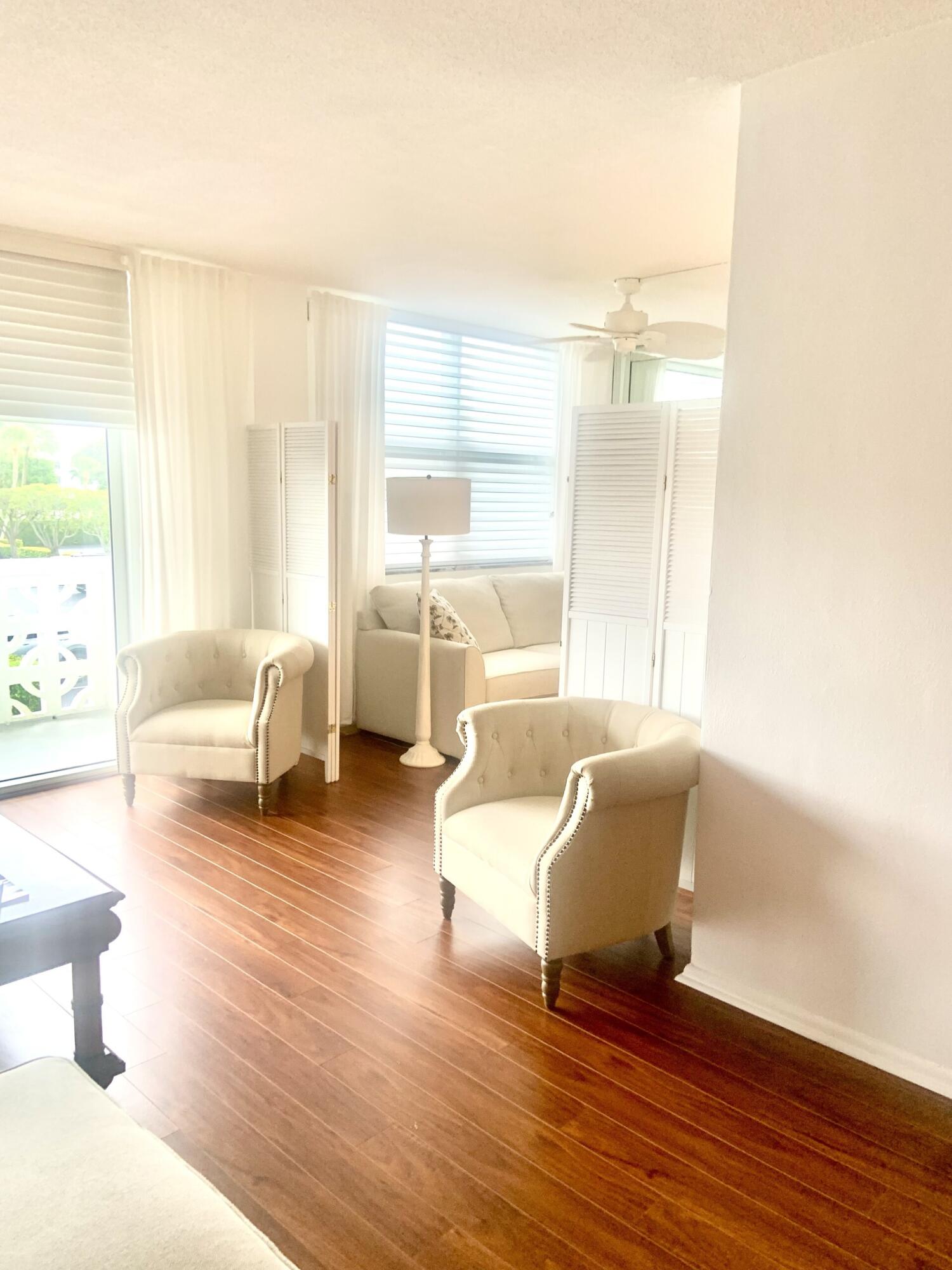 2840 South Ocean Boulevard, Unit 2050 Palm Beach, FL 33480 - Photo 5 of 18 a living room with furniture and a large window