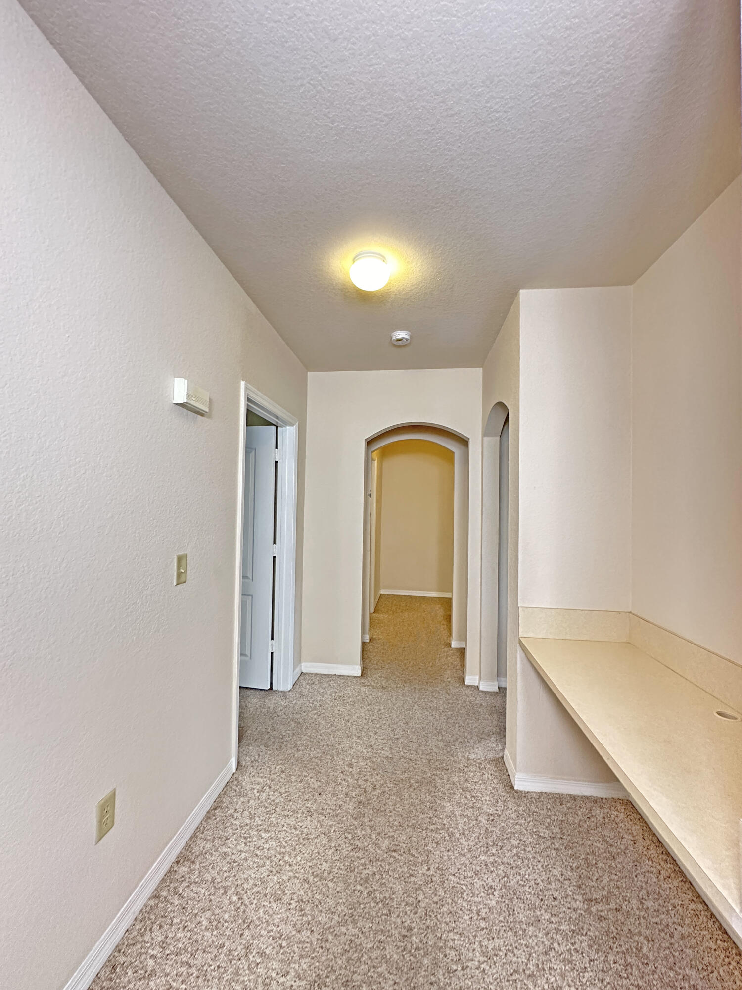 166 Southwest Peacock Boulevard, Unit 34202 Port St. Lucie, FL 34986 - Photo 16 of 56 a view of an empty room with a gallery