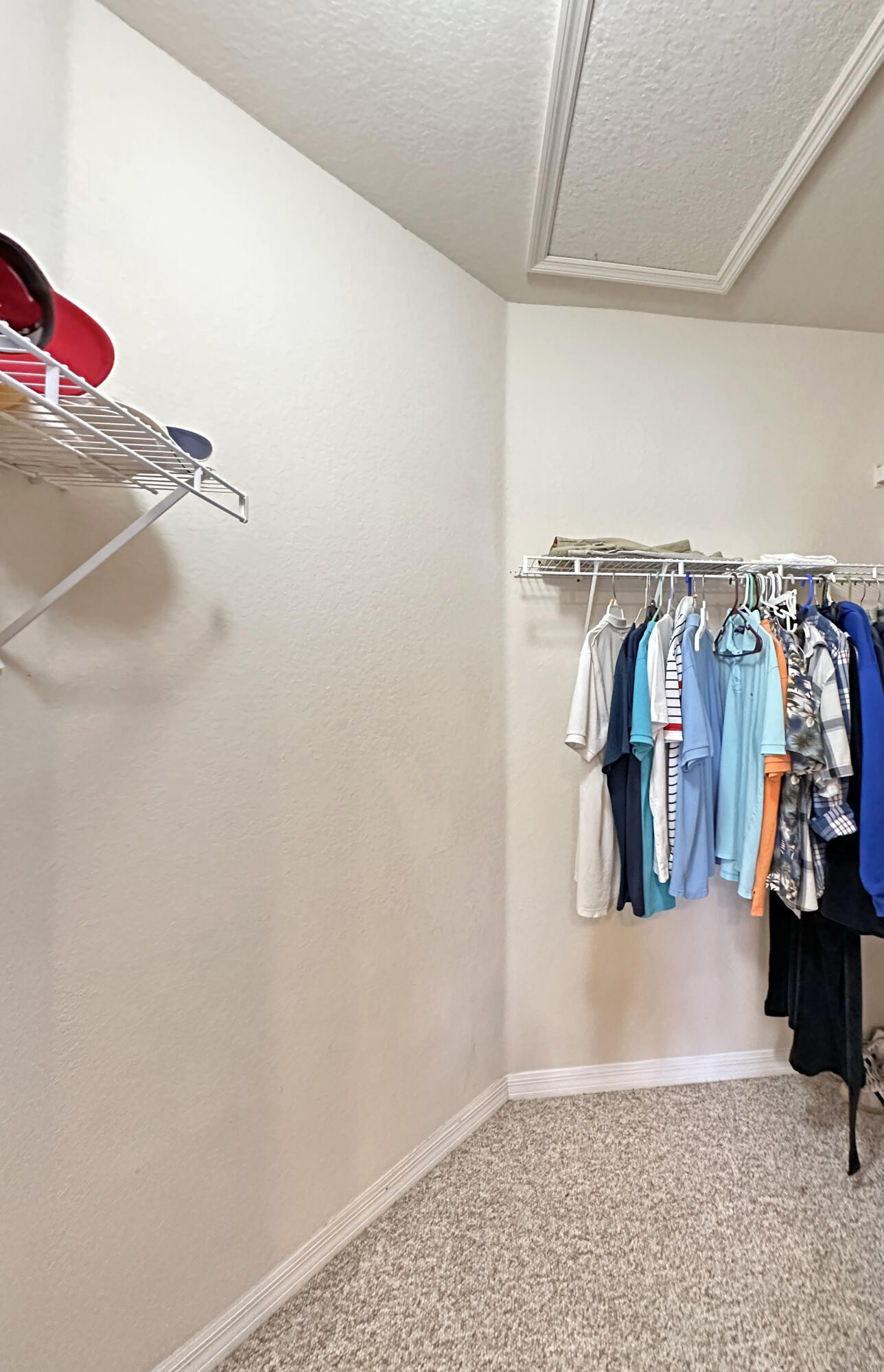 166 Southwest Peacock Boulevard, Unit 34202 Port St. Lucie, FL 34986 - Photo 24 of 56 a view of walk in closet with clothes and shoes