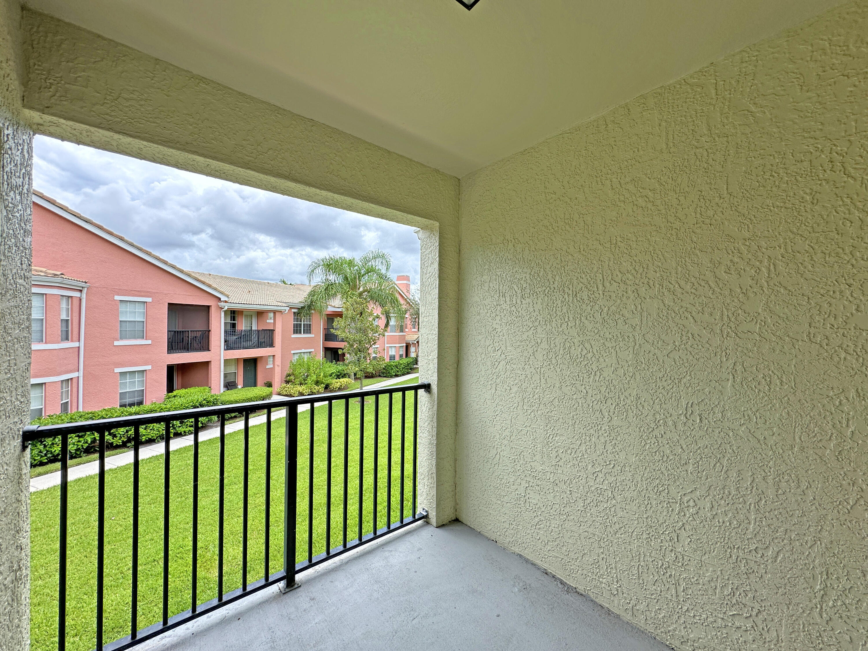 166 Southwest Peacock Boulevard, Unit 34202 Port St. Lucie, FL 34986 - Photo 36 of 56 a view of a balcony