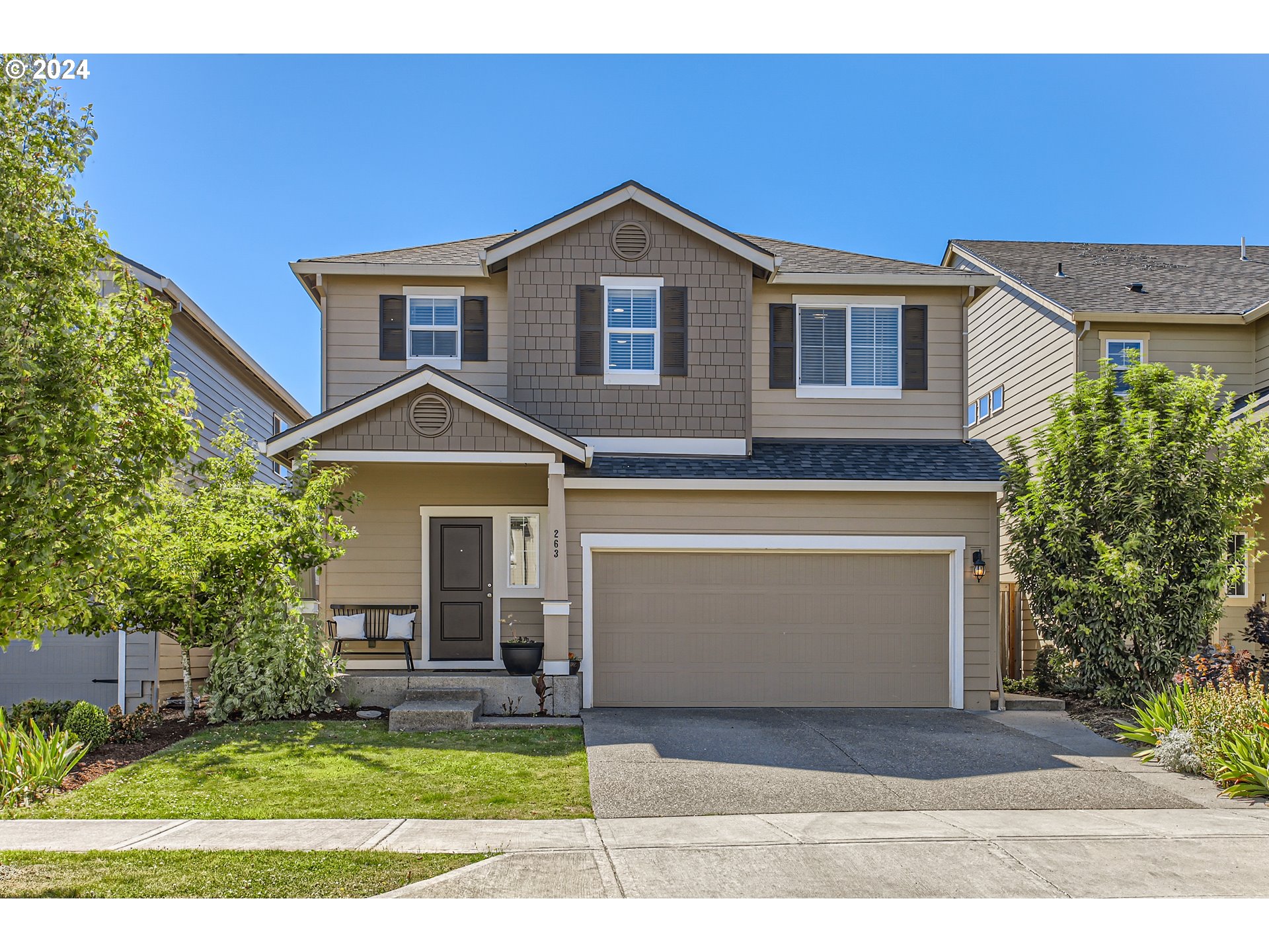 263 North 34th Court Ridgefield, WA 98642 - Photo 1 of 40 a front view of a house with a yard