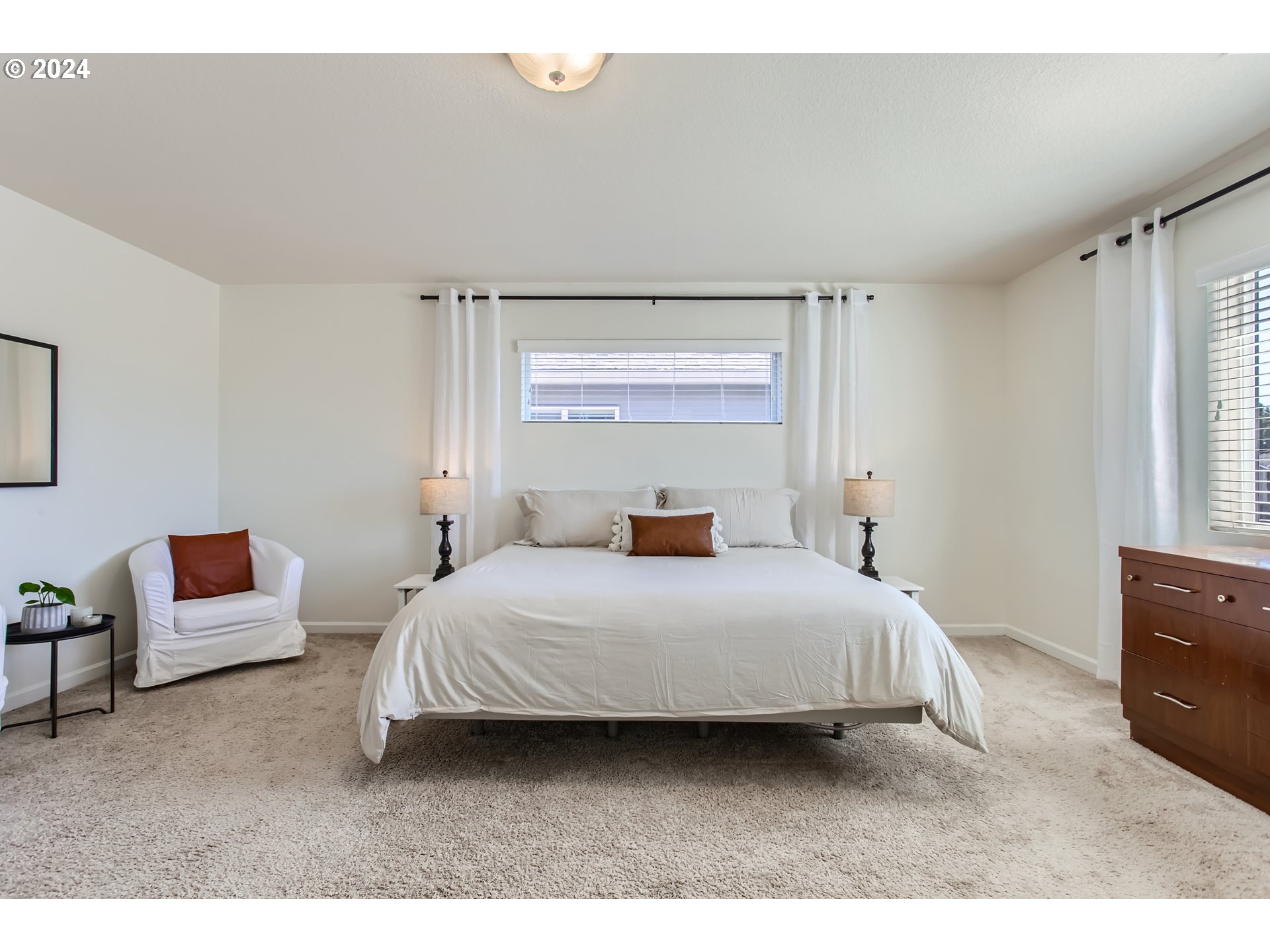 263 North 34th Court Ridgefield, WA 98642 - Photo 17 of 40 a bedroom with a bed and a couch